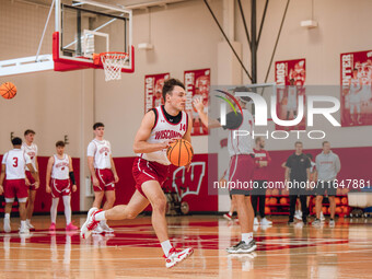 Wisconsin Badgers guard Aidan Konop #14 runs a drill during practice at the Nicholas Johnson Pavilion in Madison, WI, on October 7, 2024. (