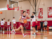 Wisconsin Badgers guard Aidan Konop #14 runs a drill during practice at the Nicholas Johnson Pavilion in Madison, WI, on October 7, 2024. (