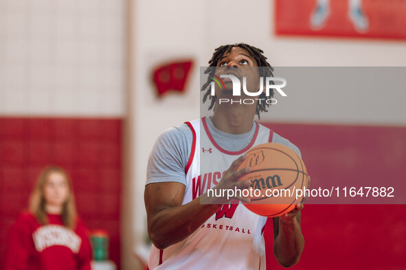 Wisconsin Badgers forward Xavier Amos #13 eyes a layup during practice at the Nicholas Johnson Pavilion in Madison, WI, on October 7, 2024. 