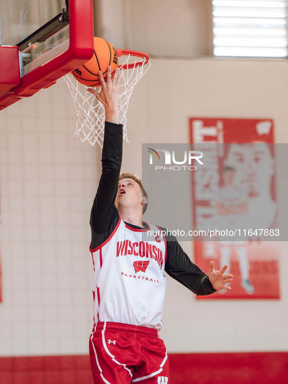 Wisconsin Badgers forward Jack Robison #2 performs a layup during a practice at the Nicholas Johnson Pavilion in Madison, WI, on October 7,...