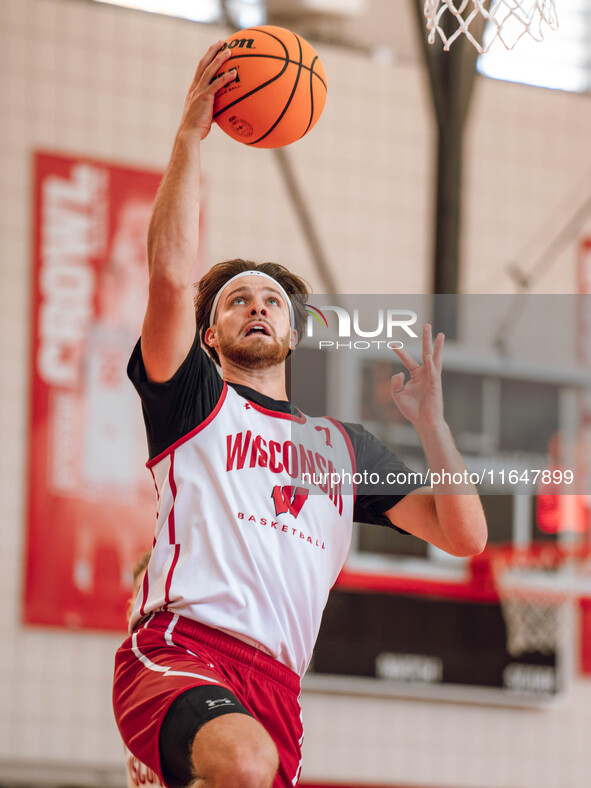 Wisconsin Badgers forward Carter Gilmore #7 goes in for a layup during practice at the Nicholas Johnson Pavilion in Madison, WI, on October...