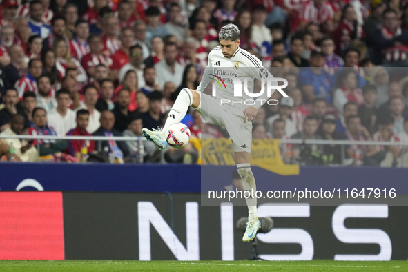 Federico Valverde central midfield of Real Madrid and Uruguay controls the ball during the LaLiga match between Atletico de Madrid and Real...