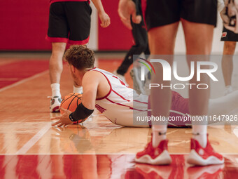 Wisconsin Badgers guard Max Klesmit #11 dives for a loose ball during practice at the Nicholas Johnson Pavilion in Madison, WI, on October 7...