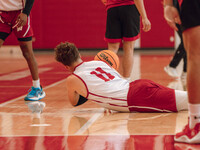 Wisconsin Badgers guard Max Klesmit #11 dives for a loose ball during practice at the Nicholas Johnson Pavilion in Madison, WI, on October 7...