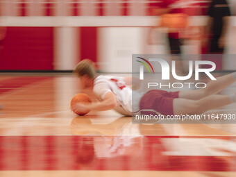 Wisconsin Badgers forward Steven Crowl #22 dives for a loose ball during practice at the Nicholas Johnson Pavilion in Madison, WI, on Octobe...