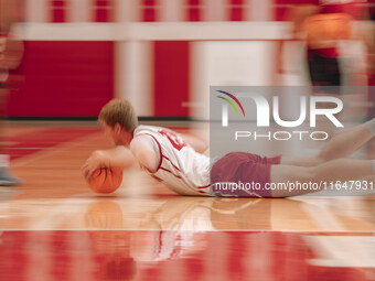 Wisconsin Badgers forward Steven Crowl #22 dives for a loose ball during practice at the Nicholas Johnson Pavilion in Madison, WI, on Octobe...