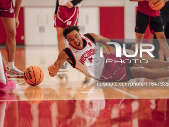 Wisconsin Badgers guard John Tonje #9 dives after a loose ball during practice at the Nicholas Johnson Pavilion in Madison, WI, on October 7...