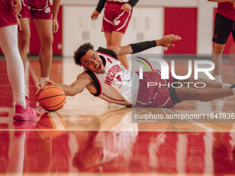 Wisconsin Badgers guard John Tonje #9 dives after a loose ball during practice at the Nicholas Johnson Pavilion in Madison, WI, on October 7...