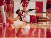 Wisconsin Badgers guard John Tonje #9 dives after a loose ball during practice at the Nicholas Johnson Pavilion in Madison, WI, on October 7...