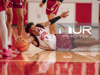 Wisconsin Badgers guard John Tonje #9 dives after a loose ball during practice at the Nicholas Johnson Pavilion in Madison, WI, on October 7...