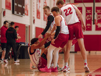 Wisconsin Badgers forward Steven Crowl #22 and guard Max Klesmit #11 help guard John Tonje #9 up off the floor during practice at the Nichol...