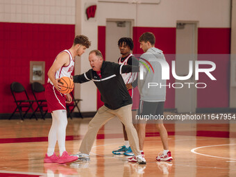 Wisconsin Badgers Head Coach Greg Gard works with guard Max Klesmit #11 during practice at the Nicholas Johnson Pavilion in Madison, WI, on...