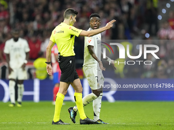 Vinicius Junior left winger of Real Madrid and Brazil talks with the referee during the LaLiga match between Atletico de Madrid and Real Mad...