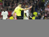 Vinicius Junior left winger of Real Madrid and Brazil talks with the referee during the LaLiga match between Atletico de Madrid and Real Mad...