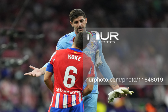 Thibaut Courtois goalkeeper of Real Madrid and Belgium and Koke Resurreccion central midfield of Atletico de Madrid and Spain talks after th...