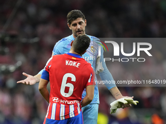 Thibaut Courtois goalkeeper of Real Madrid and Belgium and Koke Resurreccion central midfield of Atletico de Madrid and Spain talks after th...