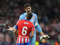 Thibaut Courtois goalkeeper of Real Madrid and Belgium and Koke Resurreccion central midfield of Atletico de Madrid and Spain talks after th...