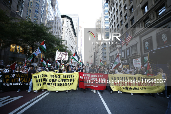 Palestinian supporters march through the streets with flags and signs against the October 2023 Israeli incursion of Gaza, on October 7, 2024...