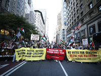 Palestinian supporters march through the streets with flags and signs against the October 2023 Israeli incursion of Gaza, on October 7, 2024...