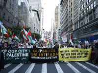 Palestinian supporters march through the streets with flags and signs against the October 2023 Israeli incursion of Gaza, on October 7, 2024...