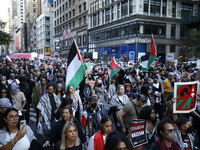 Palestinian supporters march through the streets with flags and signs against the October 2023 Israeli incursion of Gaza, on October 7, 2024...