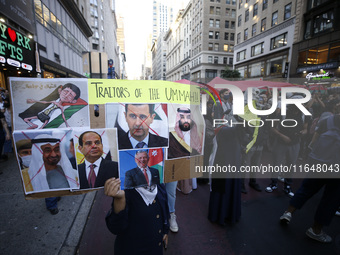 Palestinian supporters march through the streets with flags and signs against the October 2023 Israeli incursion of Gaza, on October 7, 2024...