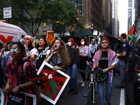 Palestinian supporters march through the streets with flags and signs against the October 2023 Israeli incursion of Gaza, on October 7, 2024...