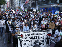 Palestinian supporters march through the streets with flags and signs against the October 2023 Israeli incursion of Gaza, on October 7, 2024...