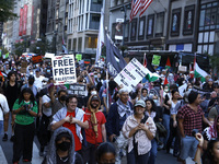 Palestinian supporters march through the streets with flags and signs against the October 2023 Israeli incursion of Gaza, on October 7, 2024...