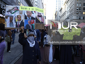 Palestinian supporters march through the streets with flags and signs against the October 2023 Israeli incursion of Gaza, on October 7, 2024...