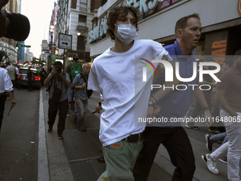 Palestinian supporter is arrested by the New York City police during a march against the October 2023 Israeli incursion of Gaza, on October...