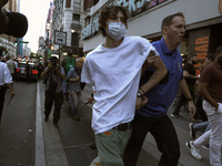 Palestinian supporter is arrested by the New York City police during a march against the October 2023 Israeli incursion of Gaza, on October...