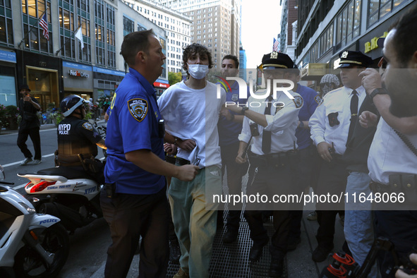 Palestinian supporter is arrested by the New York City police during a march against the October 2023 Israeli incursion of Gaza, on October...