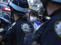 Palestinian supporter is arrested by the New York City police during a march against the October 2023 Israeli incursion of Gaza, on October...