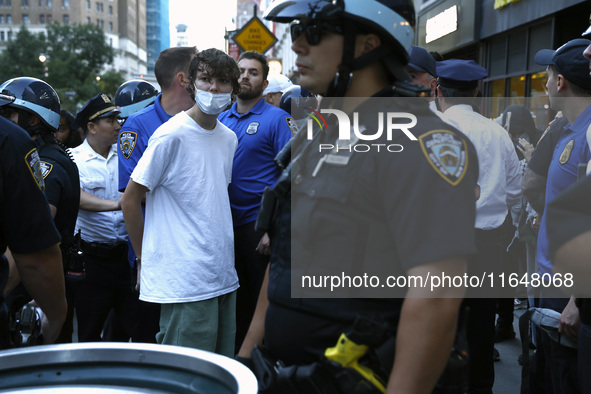 Palestinian supporter is arrested by the New York City police during a march against the October 2023 Israeli incursion of Gaza, on October...