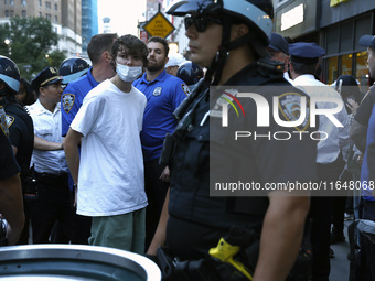 Palestinian supporter is arrested by the New York City police during a march against the October 2023 Israeli incursion of Gaza, on October...