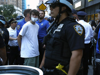 Palestinian supporter is arrested by the New York City police during a march against the October 2023 Israeli incursion of Gaza, on October...