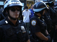 Palestinian supporter is arrested by the New York City police during a march against the October 2023 Israeli incursion of Gaza, on October...