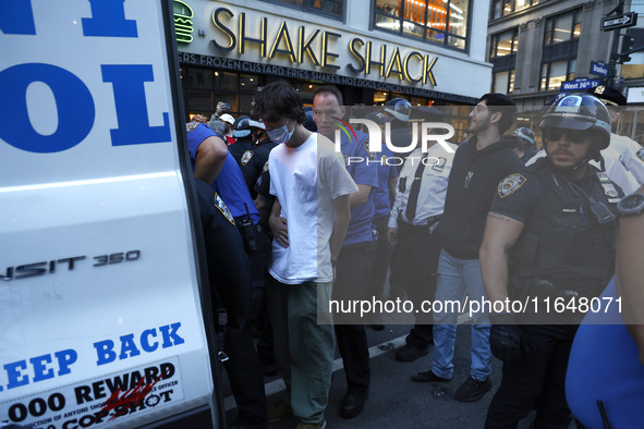 Palestinian supporters are arrested by the New York City police during a march against the October 2023 Israeli incursion of Gaza, on Octobe...