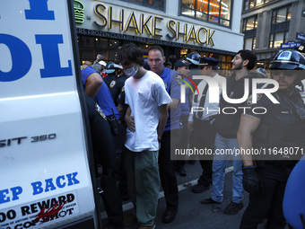 Palestinian supporters are arrested by the New York City police during a march against the October 2023 Israeli incursion of Gaza, on Octobe...