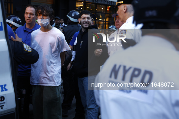 Palestinian supporters are arrested by the New York City police during a march against the October 2023 Israeli incursion of Gaza, on Octobe...