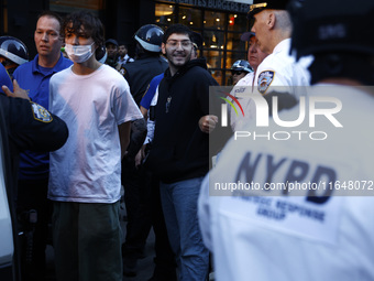 Palestinian supporters are arrested by the New York City police during a march against the October 2023 Israeli incursion of Gaza, on Octobe...