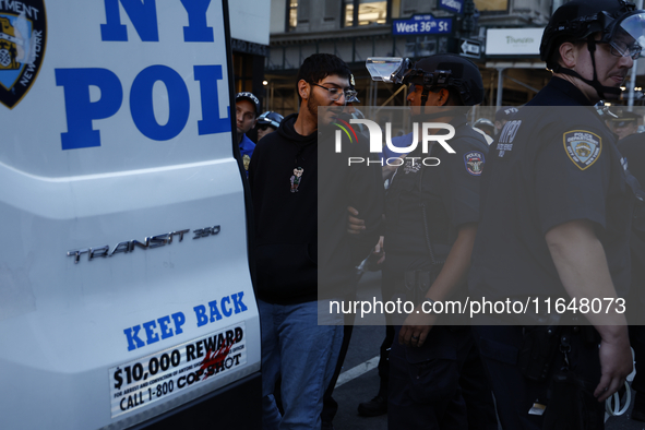 Palestinian supporters are arrested by the New York City police during a march against the October 2023 Israeli incursion of Gaza, on Octobe...