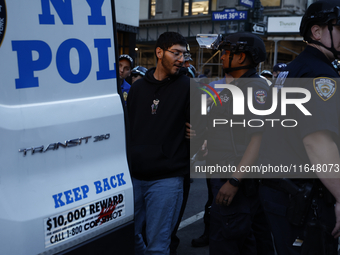 Palestinian supporters are arrested by the New York City police during a march against the October 2023 Israeli incursion of Gaza, on Octobe...