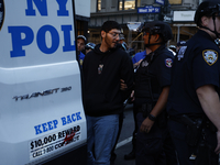 Palestinian supporters are arrested by the New York City police during a march against the October 2023 Israeli incursion of Gaza, on Octobe...