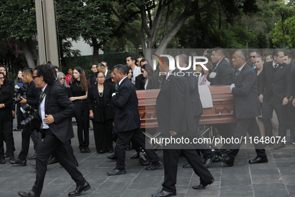 Persons carry a coffin with the body of Ifigenia Martinez during the posthumous funeral tribute in honor of Ifigenia Martinez, 99, in the Ch...