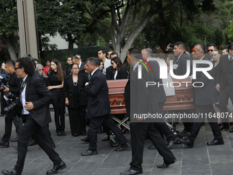 Persons carry a coffin with the body of Ifigenia Martinez during the posthumous funeral tribute in honor of Ifigenia Martinez, 99, in the Ch...