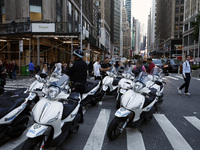 New York City Police motorcycles stand as Palestinian supporters march through the streets with flags and signs against the October 2023 Isr...