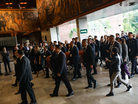 Persons carry a coffin with the body of Ifigenia Martinez during the posthumous funeral tribute in honor of Ifigenia Martinez, 99, in the Ch...