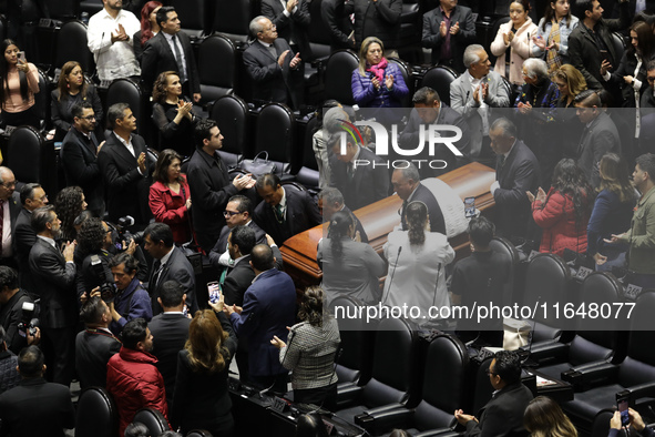 Persons carry a coffin with the body of Ifigenia Martinez during the posthumous funeral tribute in honor of Ifigenia Martinez, 99, in the Ch...